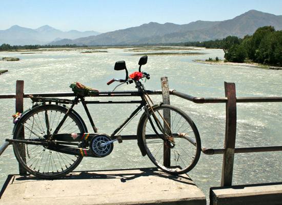 Bicycle, lake and mountains