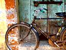 Bicycle against an old door